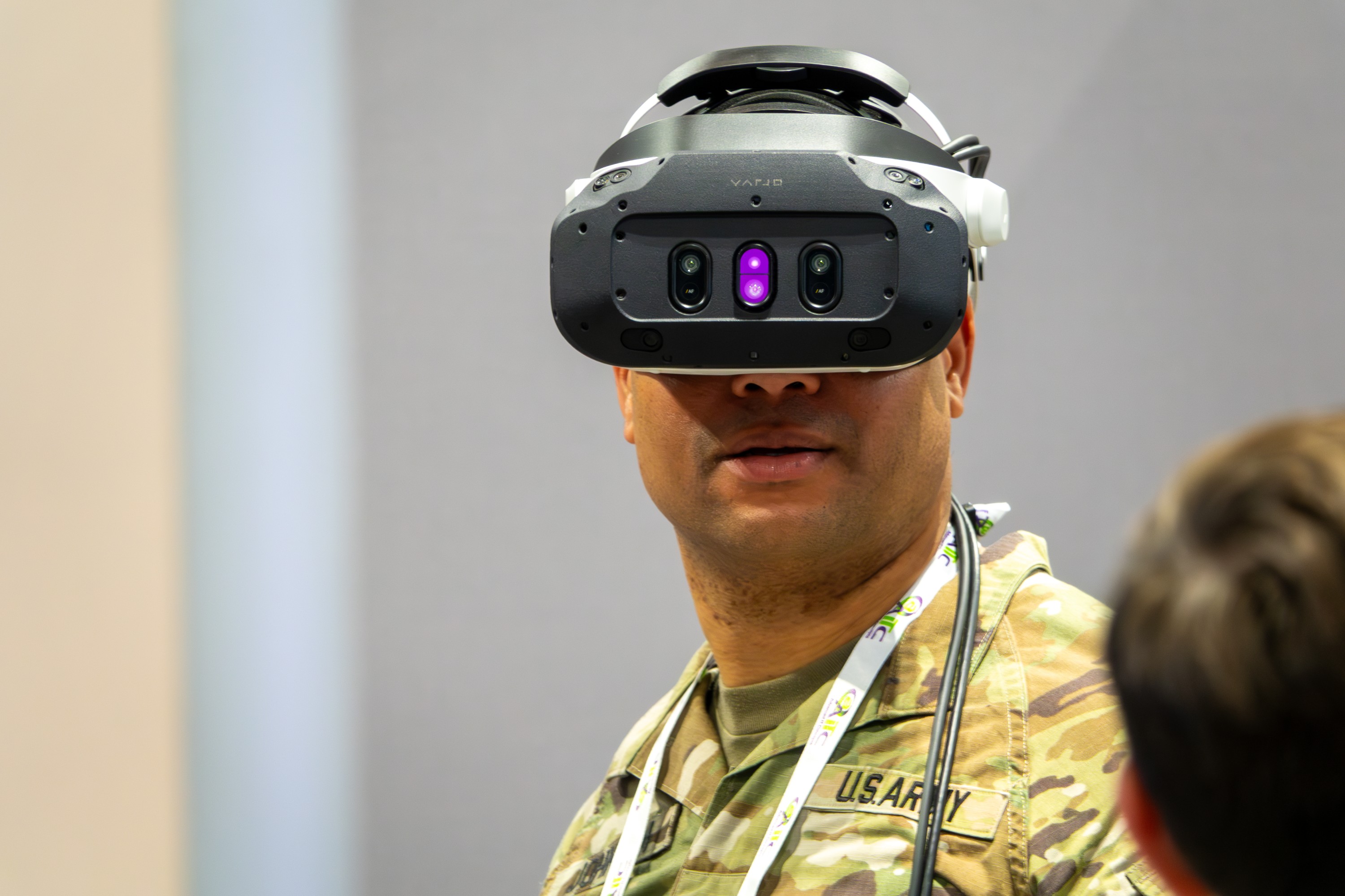 a person in military gear wearing a VR headset