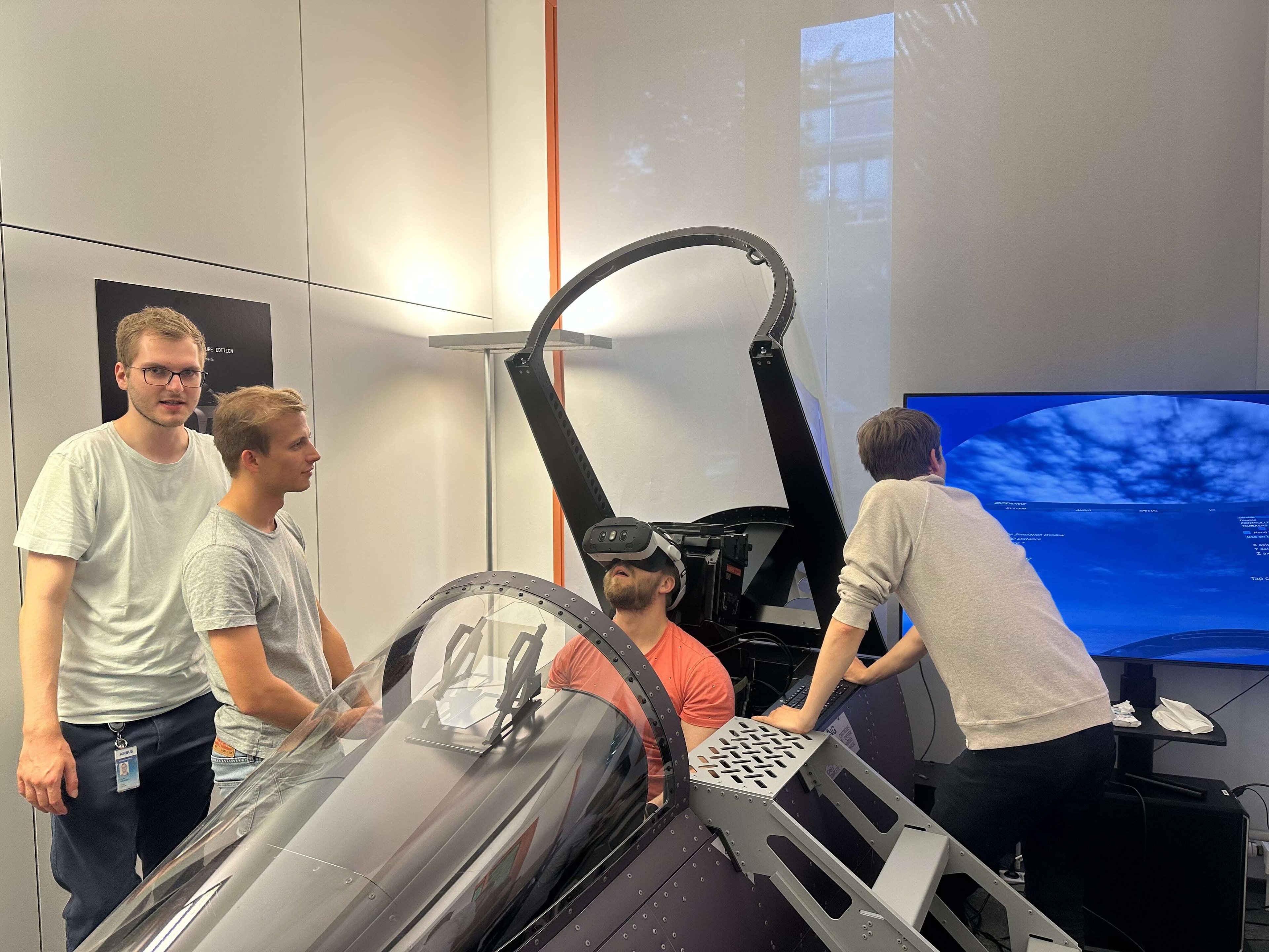 a room with an F-18 flight simulator