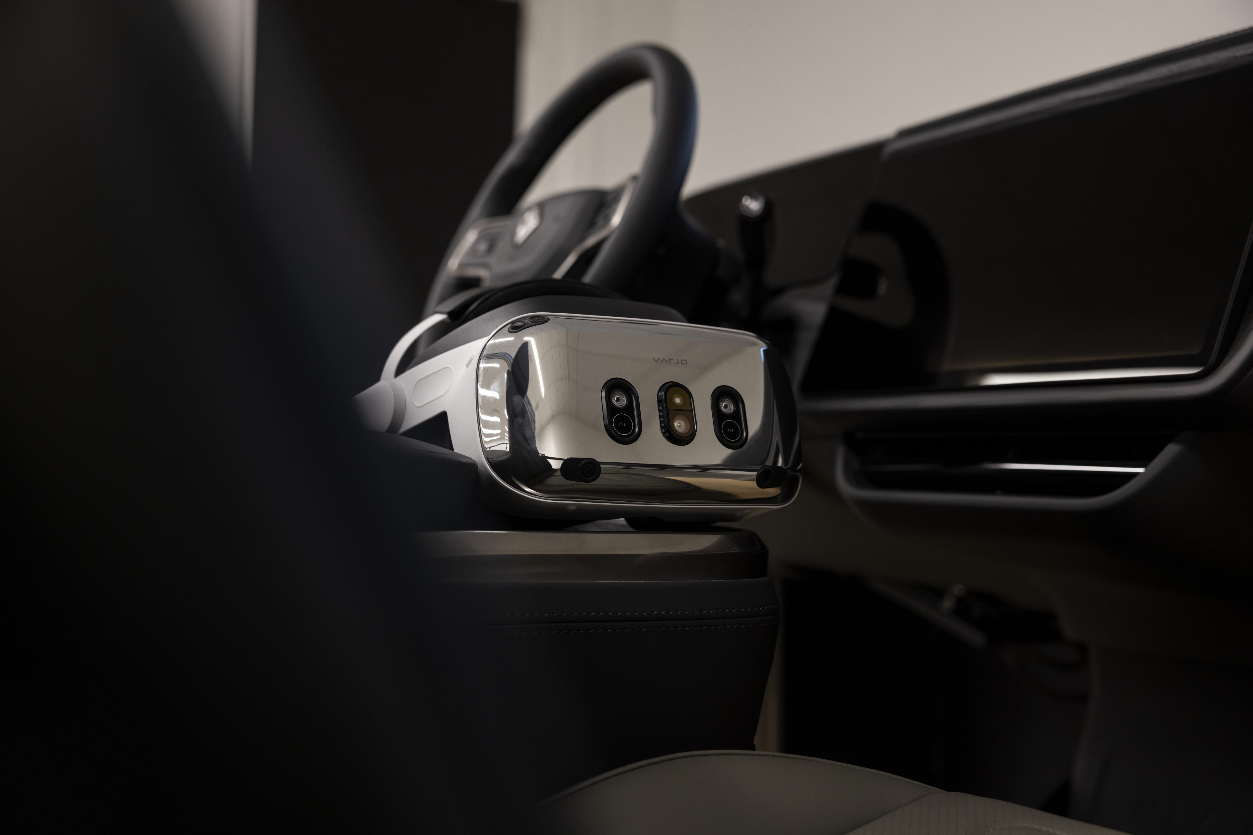 A varjo XR-4 Series headset on a car seat