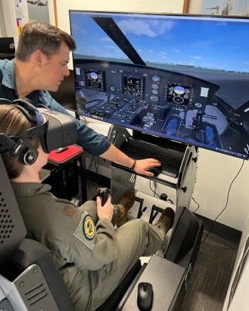 A person training in a cockpit simulator
