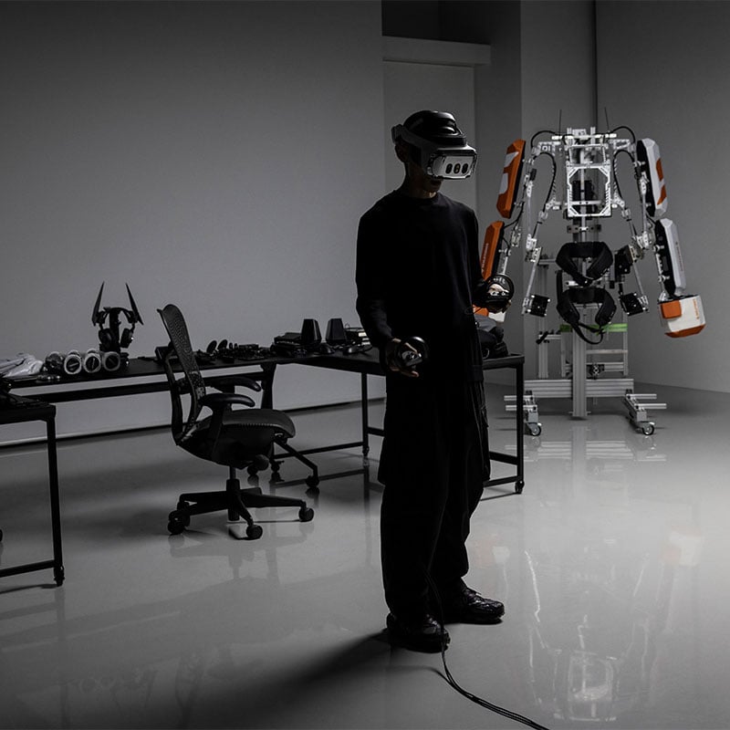 A person in a VR lab using a mixed reality headset